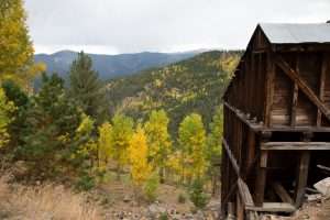 Mine in Colorado with Aspen trees in the background