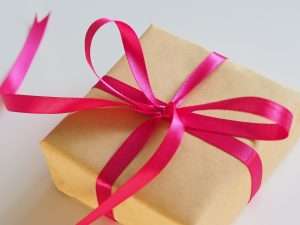 Gift wrapped in paper with pink bow